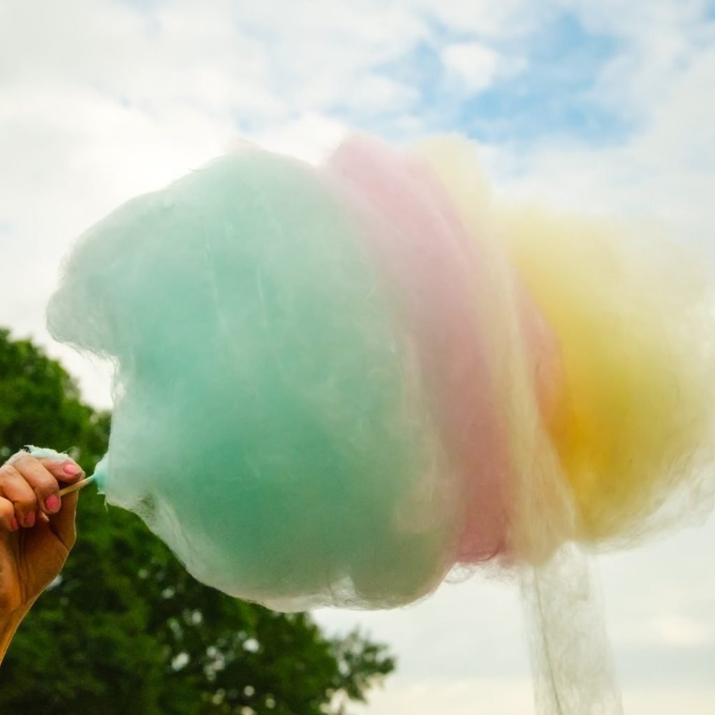 an image of a multi-color cotton candy cone