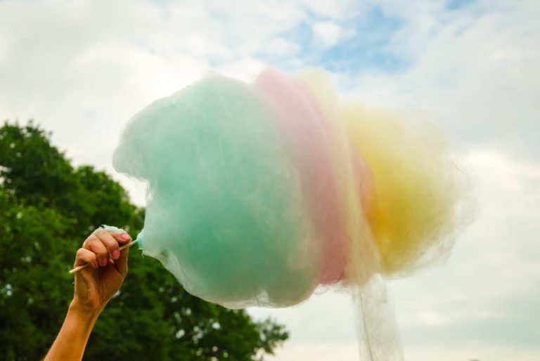 an image of a multi-color cotton candy cone