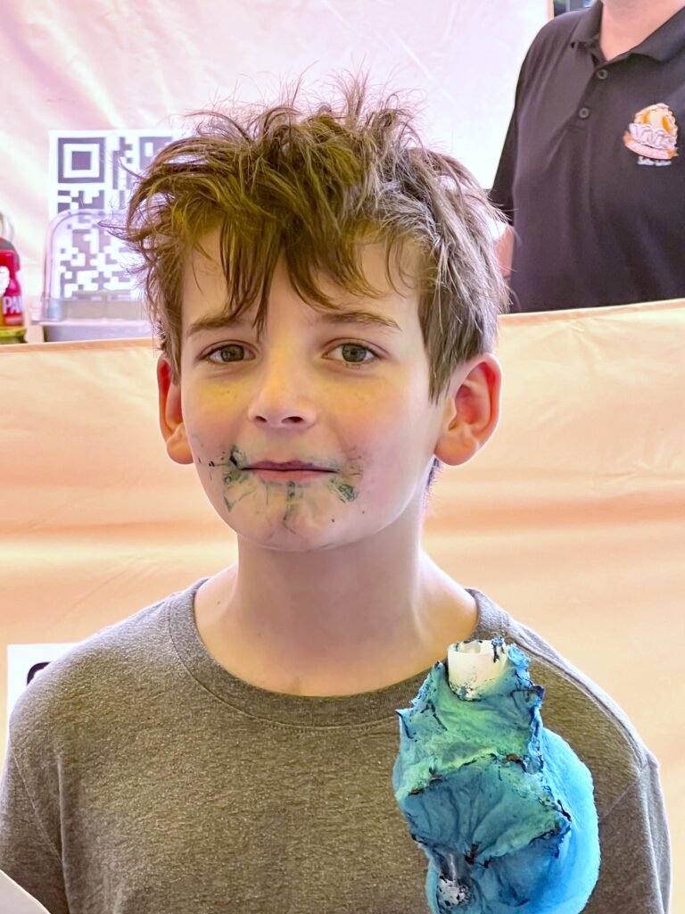 small boy with blue cotton candy